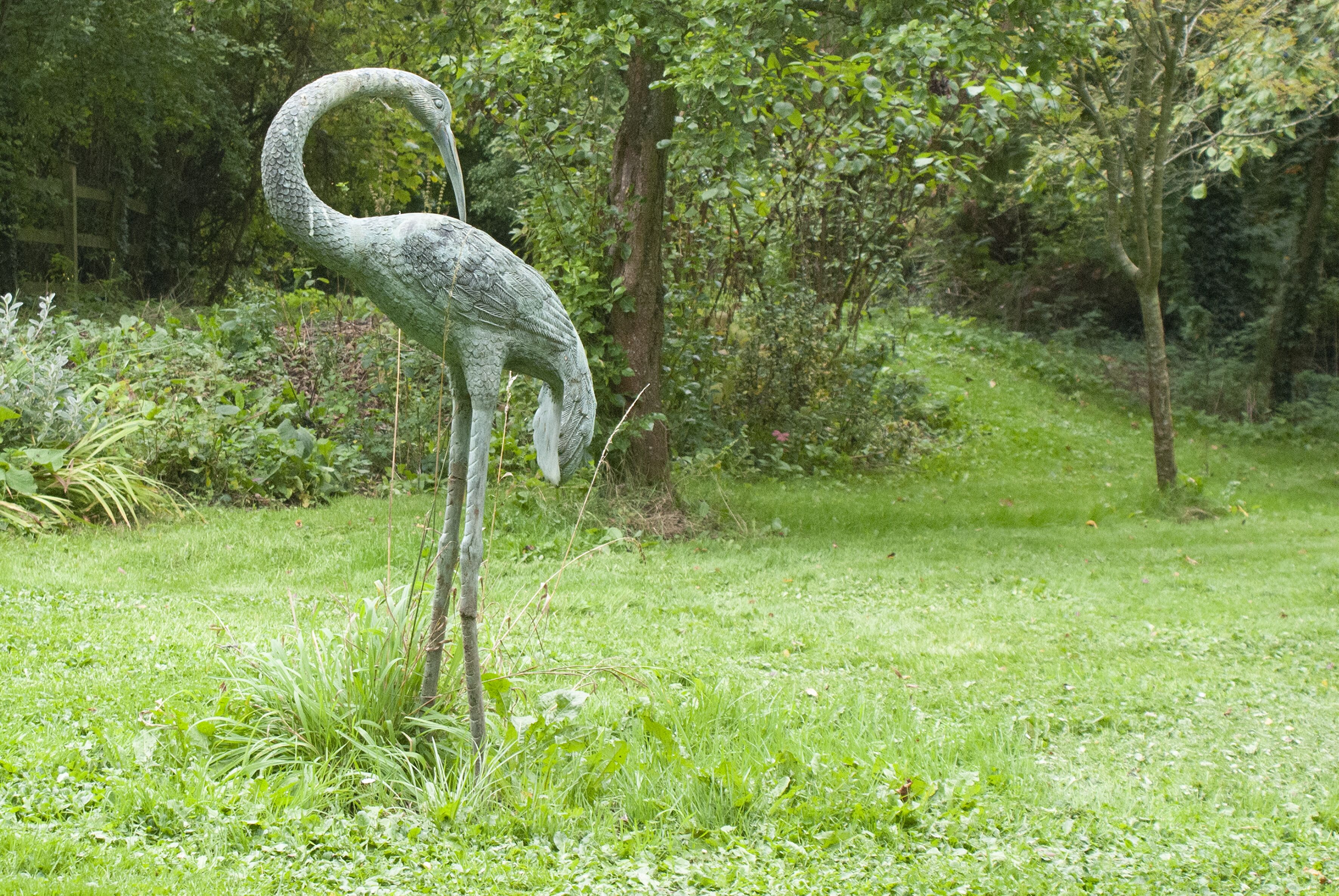 Copper Herron Statue in private garden