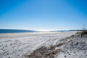 On the beach, sun loungers, beach towels