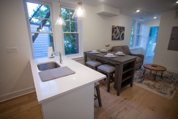 32-inch flat-screen TV with digital channels, TV, Hulu - Woodley Suites & Residences (Washington)