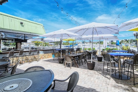 Outdoor dining. All-New, First Floor, Huge Pool, 70" TV, Tiki Bar!
