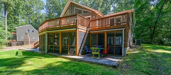 Lakefront home with deck, hot tub, game room, kayaks, & fireplace