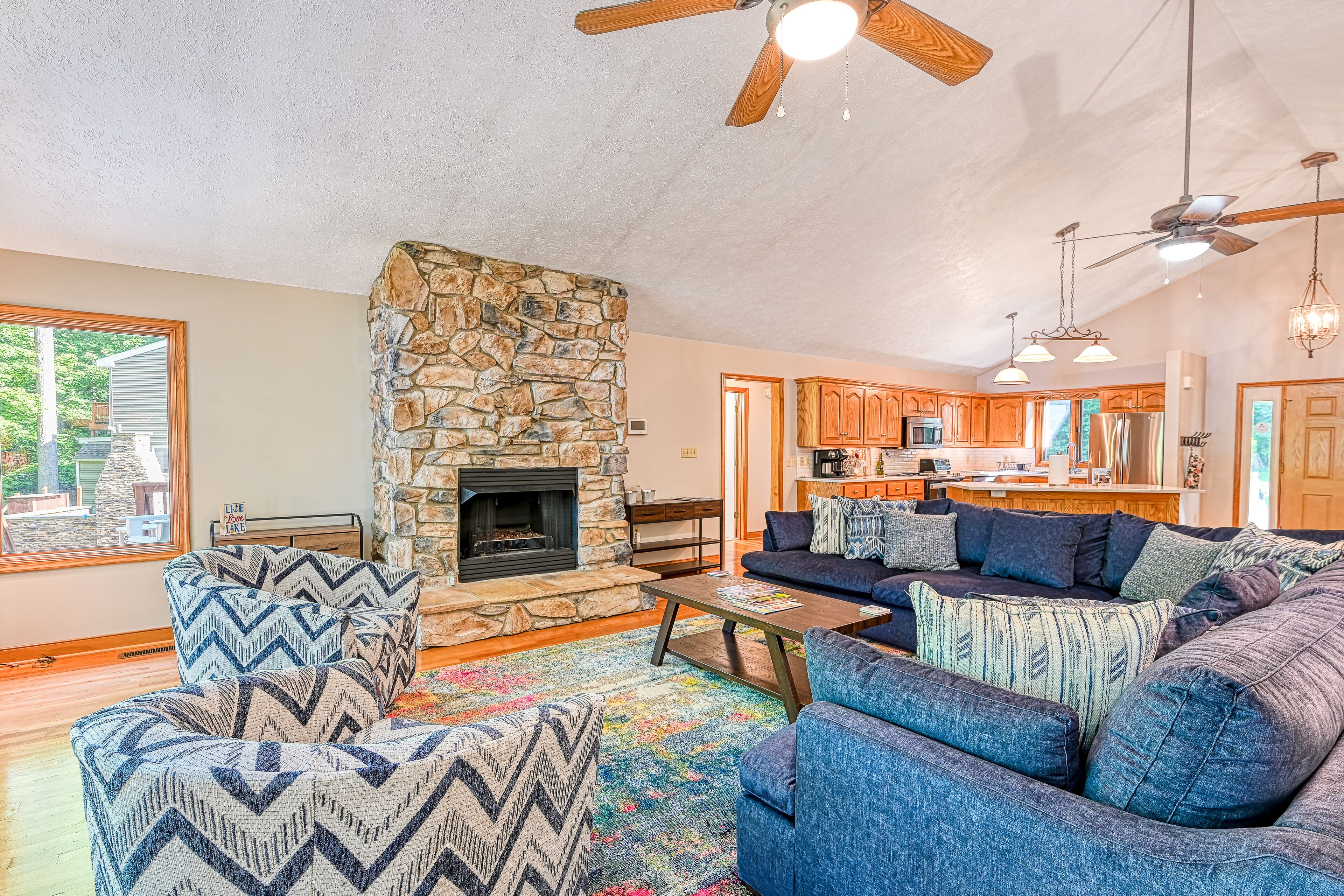 Lakefront home with deck, hot tub, game room, kayaks, & fireplace