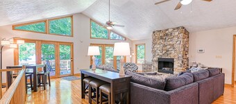 Lakefront home with deck, hot tub, game room, kayaks, & fireplace