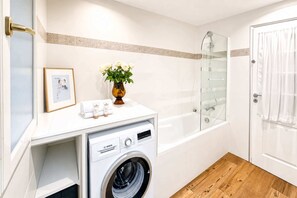 Shower, hair dryer, towels