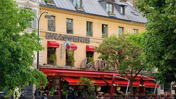 A restaurant named "Brasserie Chez Jenny" with outdoor seating and red awnings. - Spacious & modern property in Le Marais (Paris)
