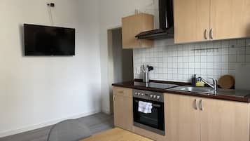 Appartement Classique | Cuisine privée | Réfrigérateur, micro-ondes, plaque de cuisson, grille-pain