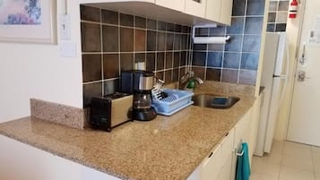 Fridge, microwave, stovetop, coffee/tea maker
