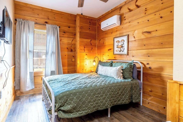 Our master bedroom includes a TV for your viewing pleasure and a dresser for unpacking during your stay