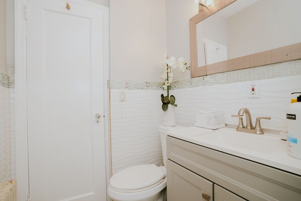 Shower, jetted bath, towels, soap