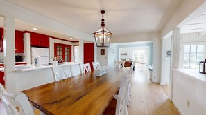 Enjoy meal preparation and dining at the central island or large dining table in this well-designed kitchen.