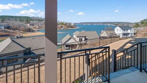 A residential area with a view of a lake, houses, and a dock. - Mallard Pointe 100 - Luxury condo- conveniently located! (Cullman)