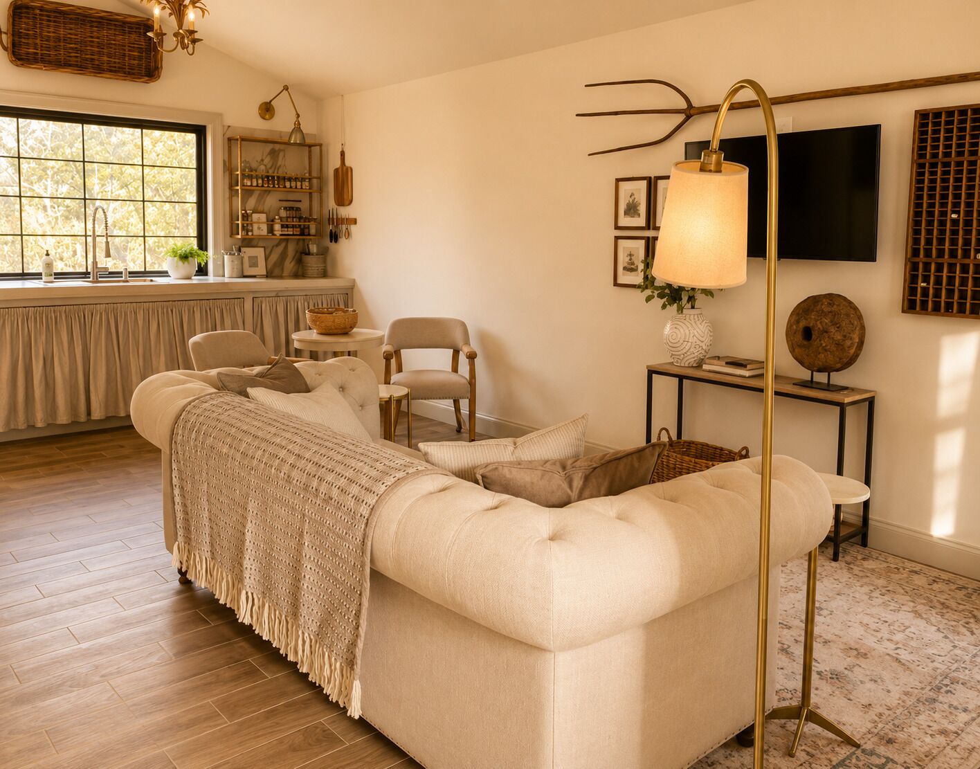 A living room with a sofa, chairs, a lamp, and a television.