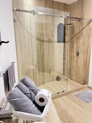 Shower, towels, soap, toilet paper