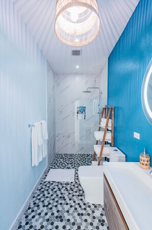 Bathtub, hair dryer, towels, soap