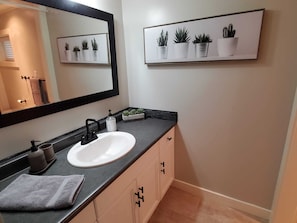 Combined shower/tub, hair dryer, towels, soap