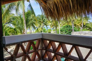 Superior Quadruple Room, 2 Queen Beds, Partial Ocean View, Beachside | Terrace/patio