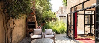 Bright, accessible 2-bed art-deco flat with private garden, step-free layout and wet room shower.