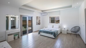 A modern bedroom with a large bed, a desk, and a chair. There is a sliding glass door leading to a balcony. - Amazing Villa on Protaras with Private Pool, Protaras Villa 1586 (Protaras)