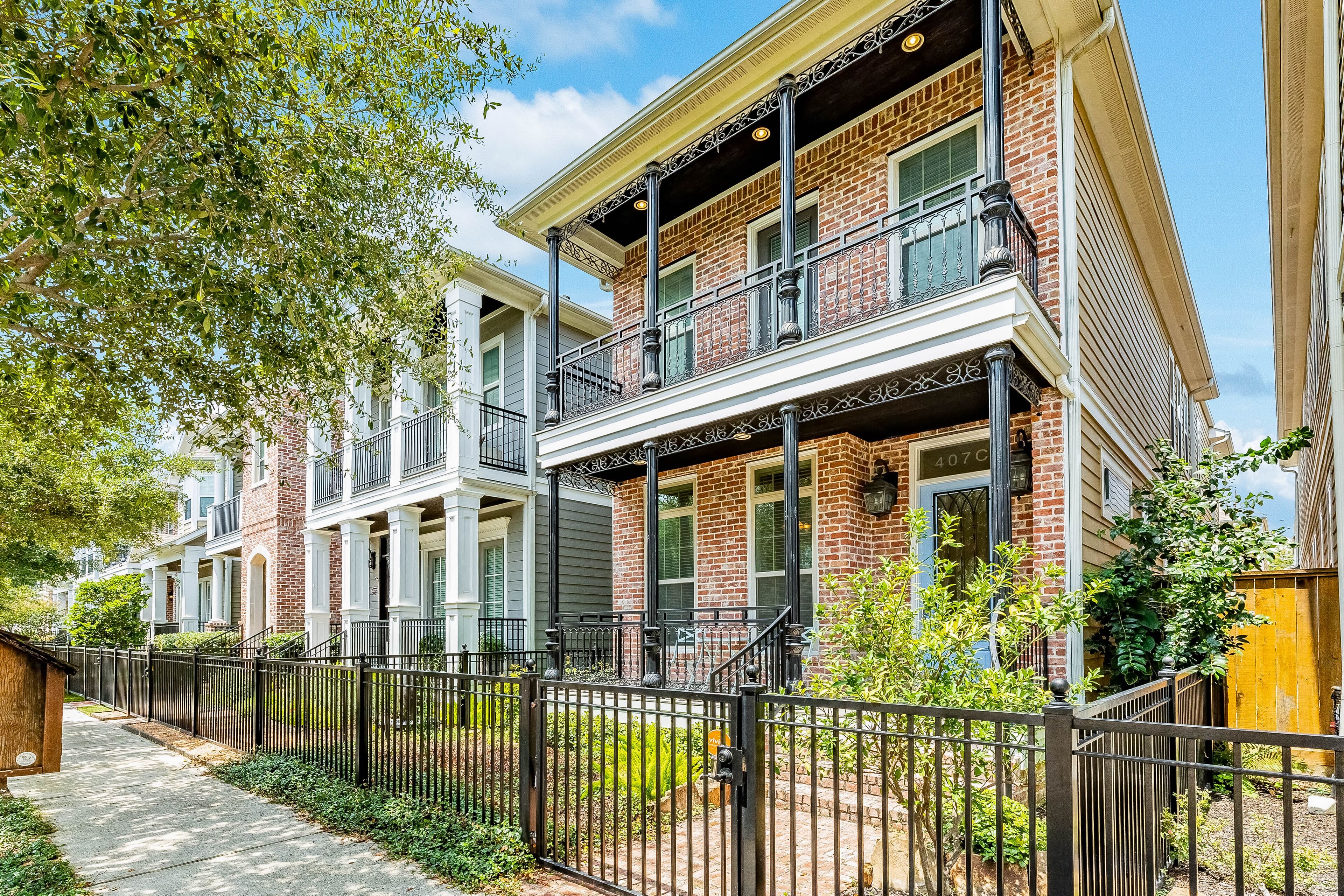 Stylish, two-story townhouse with enclosed yard, washer/dryer, & AC