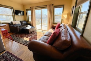Relax in this inviting living room with a sofa, couch, and flat-screen TV.