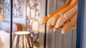 A wooden sculpture of hands in a room with a lamp and a painting on the wall. - Studio - Sleeps 2 Guests (York)