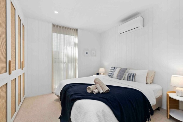 Elegant bedroom with king-size bed, premium linens, and ensuite