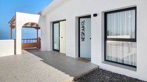 A modern building with a covered outdoor area, a door labeled 'NEGRAMOL,' and large windows. - Vacation Home 'Linaje del Pago Negramol' with Sea View, Pool & Wi-Fi (Sauzal)