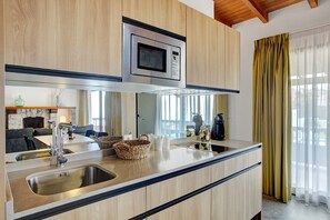 Fridge, microwave, stovetop, coffee/tea maker