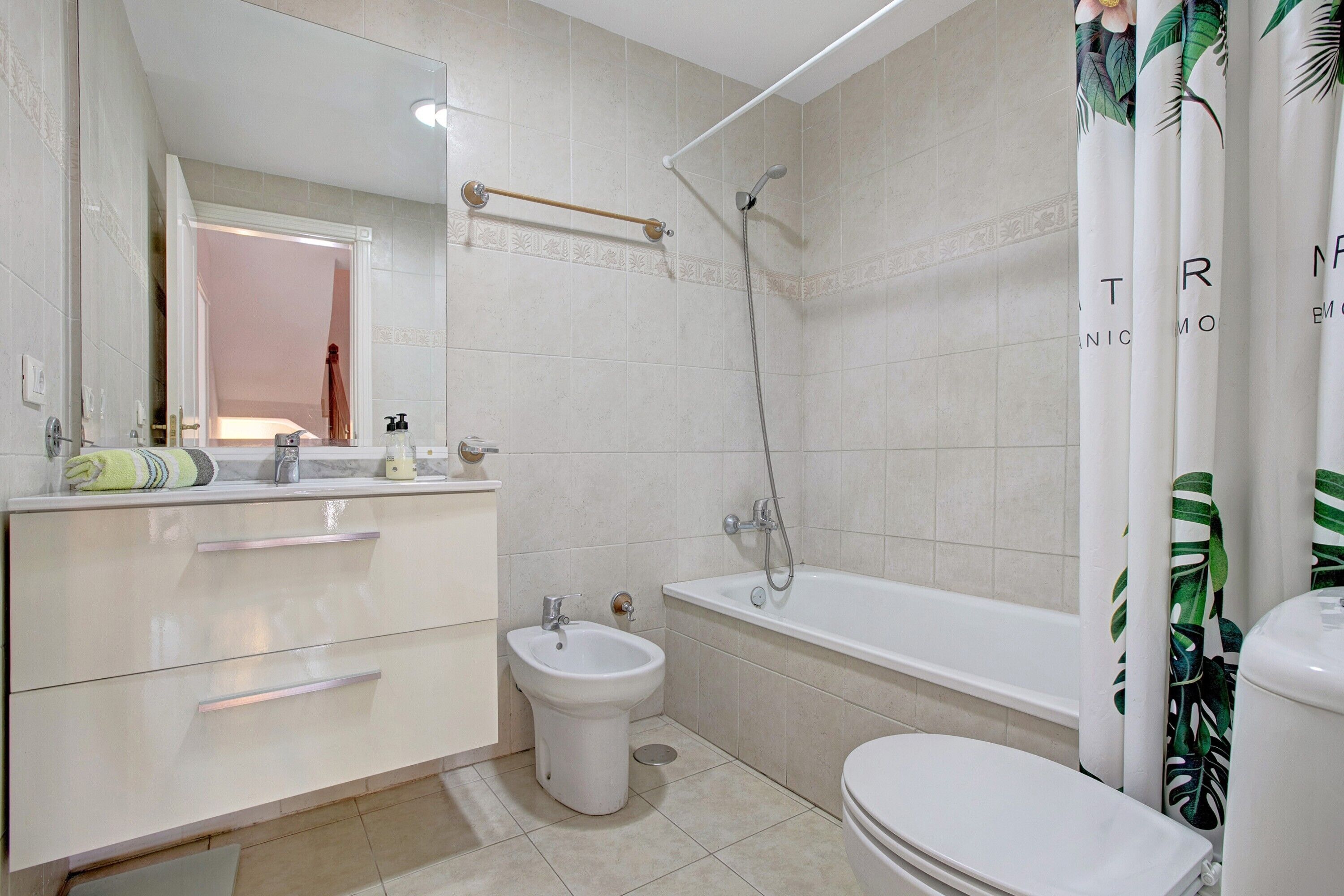 Bathtub, hair dryer, towels