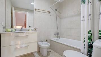 Bathtub, hair dryer, towels