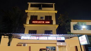 A building with a sign reading "HARSHTA INN" at the top. - New Harshita inn By Glitz Hotel  (Navi Mumbai)