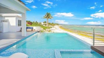 An infinity pool, sun loungers