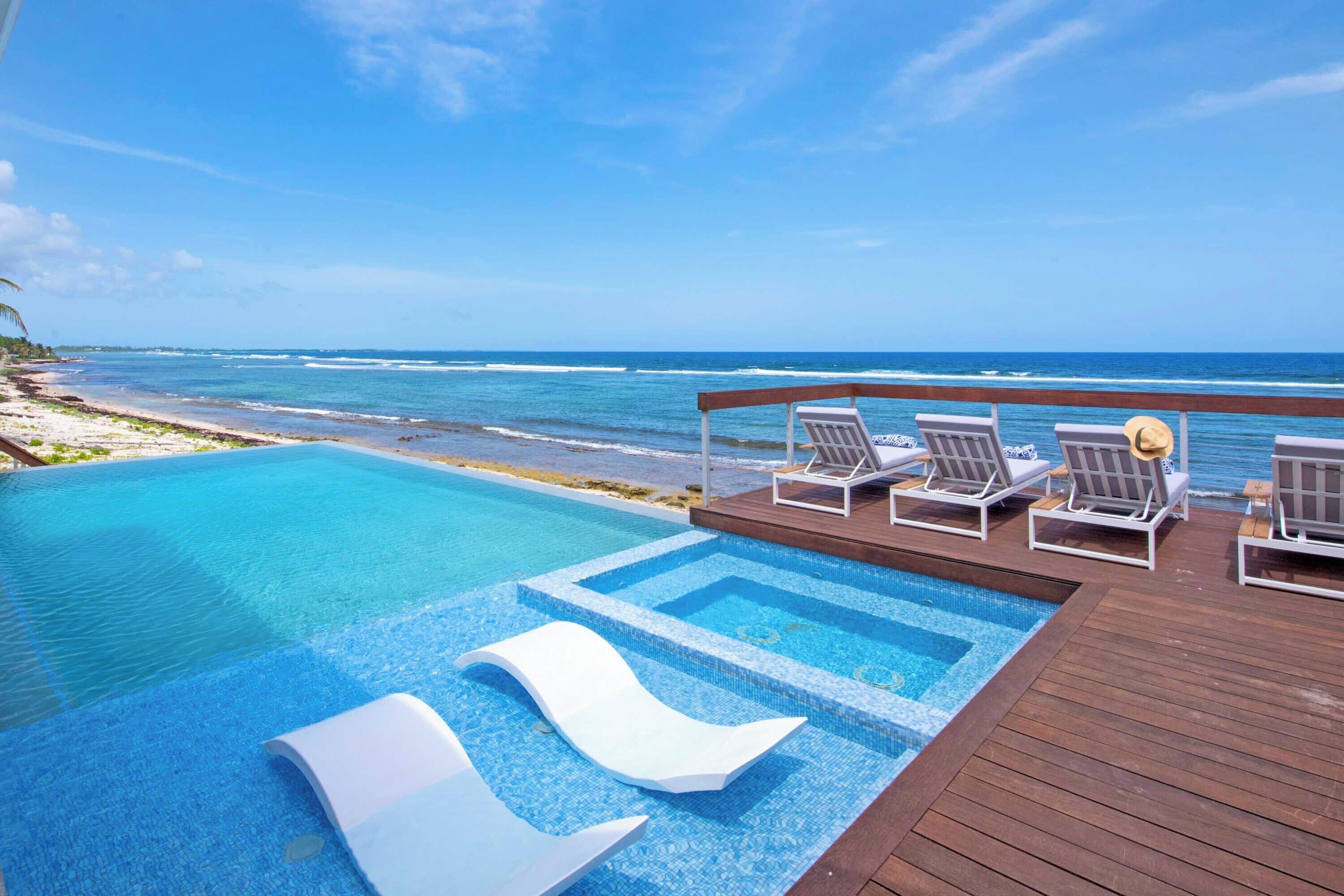 An infinity pool, pool loungers