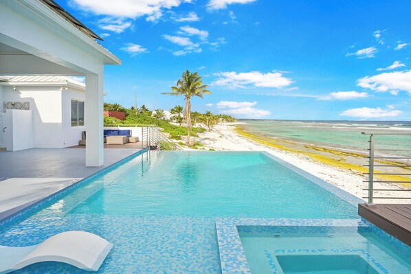 An infinity pool, pool loungers