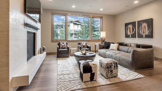 A modern living room with a fireplace, large windows, and a cozy seating area. - Premium Junior Three Bedroom 3 Apartment Hotel by Redawning (Park City)