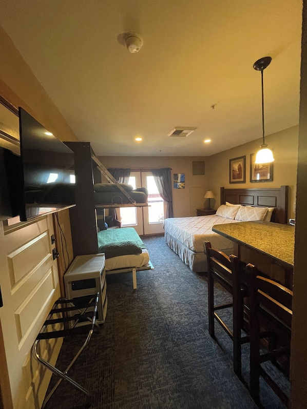1 bedroom, desk, iron/ironing board, travel crib