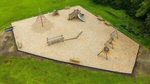 A playground with a slide, climbing structures, and a swing set. - HS#1- Modern Studio next to Premier Sports Complex (Bradenton)