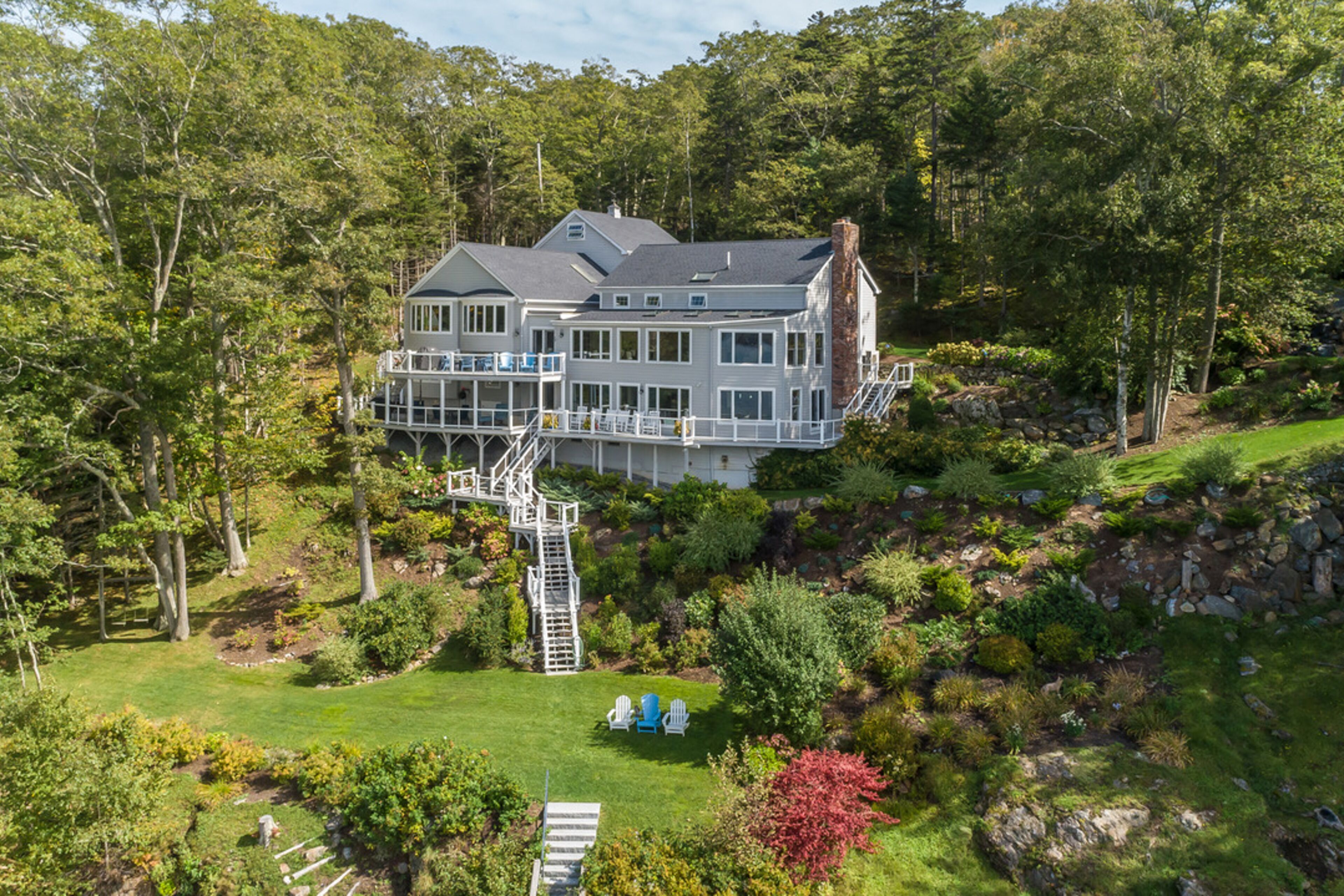 Luxe waterfront retreat with dock, decks, pool table, fireplaces, & home office