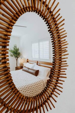 A bedroom with a bed, a nightstand, a lamp, and a window. - THE PALMIERI luxe home with incredible pool area near DT SRQ (Sarasota)