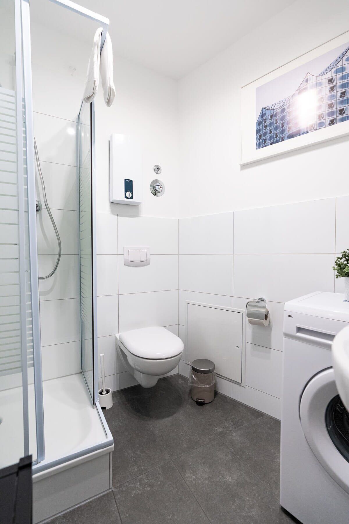 Shower, hair dryer, towels, shampoo