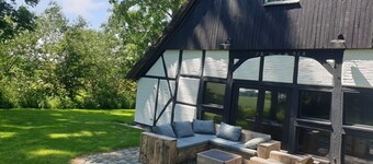 Romantic thatched-roof house with wellness area near the dyke