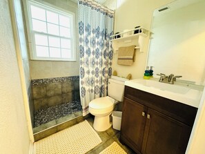 Shower, hair dryer, towels, soap