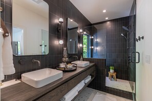Bathtub, towels, soap, shampoo