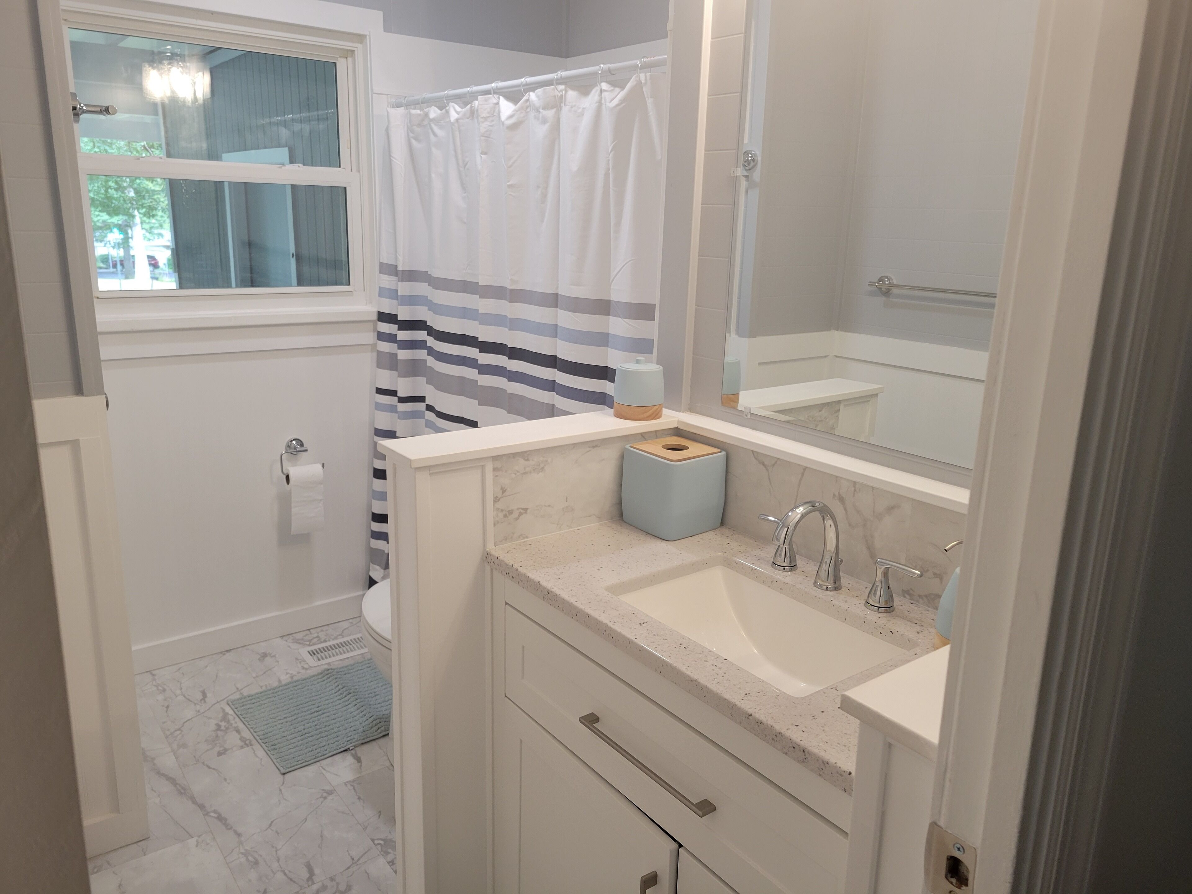 Combined shower/tub, hair dryer, towels, soap