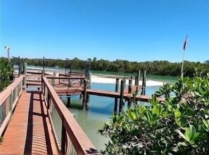 Guests can stroll along the pier, taking in the serene surroundings and lush greenery.