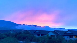 A row of cabins with a mountain backdrop and a colorful sky. - Modern 3 BD House in Cottonwood Downtown, 20 mins to Sedona.  (Cottonwood)