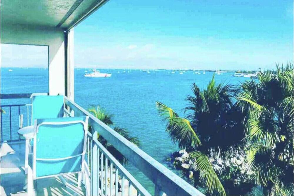 OCEANFRONT CASUAL LUXURY CONDO RENTAL 40 FT FROM THE WATER WITH BREATHTAKING & UNOBSTRUCTED VIEWS OF KEY WEST HARBOR AND THE GULF OF MEXICO. (These views are also available from the master bedroom, living area and kitchen all day, every day) <br><br>2nd FLOOR OCEANFRONT CONDO RENTAL<br>Oceanfront privacy and luxury at The Galleon Resort in Old Town, Key West / Sleeps 6 / 1 Master King - 1 Guest Queen / 1 Queen pullout / Large private oceanfront balcony with private spiral stair to sundeck, pool & hot tub, beach, Tiki Bar and Pirates Cove Grill.<br><br>EXCEPTIONAL LOCATION & CONVENIENCE<br>The Galleon Resort is located on the ocean at the end of North Front St (literally steps from your elevator to Seaport Boardwalk happy hour bar menus, shops & multiple restaurants) / 2 blocks to Duval St + more restaurants, Mallory Square, Front Street eateries, bars and shopping—or cook steaks & seafood on newly renovated large picnic patio with Pro BBQ grills & umbrella picnic tables / 3 HD cable TVs in condo / Free wireless internet / Free private parking / Secluded but very close to all the action / Car not necessary / Rental scooters, bikes, electric golf carts, wave runners on site to explore Key West from land or water / Oceanfront Tiki Bar & Pirates Cove Marina Bar & Grill on premises<br><br>RECOGNIZED & VOTED IN 2016-17-18 AS A "TOP-25 TIMESHARE RENTAL RESORT" BY TIMESHARE USERS WORLDWIDE<br><br>BEAUTIFULLY LANDSCAPED OCEANFRONT SWIMMING POOL & HOT TUB, LARGE NEW OCEANFRONT COVERED TIKI BAR, NEW SUN DECKS & GAZEBOS, SMALL PRIVATE BEACH & OCEAN SWIM AREA w PLATFORM, PRIVATE FISHING PIER & NEW BBQ PATIO<br><br>Full-service resort with on-premises concierge, housekeeping, maintenance and 24-hour security staffing with computerized door entry cards, security cameras, and room safes for guests.<br><br>Children welcome. Suitable for seniors and handicapped with four elevators, ramps to pool, outdoor hot-tub, beach, Granite sitting ledges in Master Bathroom and open entry from walk-in shower to Jacuzzi<br><br>96-unit oceanfront property accessible by car or boat, with free parking and rented boat slips / Great for families & sailboat crews / Marina next to resort to dock your boat / Full laundry, sauna / At the entrance to the Historic Seaport boardwalk / On the ocean in the heart of Key West\'s incomparable Old Town w tin-roof conch houses, historic museums & homes, unique shops, artist galleries, and quirky Duval Street entertainment / *Don\'t miss the nightly, world-famous Mallory Square Sunset Celebration (Unique Entertainment-Food-Art-Crafts) just 2 blocks from your condo<br><br>THIS CONDO has a full size, fully equipped kitchen, breakfast area, wet bar w wine storage, washer-dryer, dining area, living room with entertainment center (55” TV, DVD player, AM-FM stereo, extra wardrobe closet, drawers) in living area, master bedroom with ensuite 2-sink vanity, closet, makeup vanity with extra device outlets, shower w attachments & jet-tub Jacuzzi, guest bedroom with full bathroom<br><br>FULL BALCONY has four chairs & table, and is accessible thru French doors in both the living room and master bedroom with sweeping view of Seaport Marina and boardwalk plus ocean views.<br><br>EXTRA AMENITIES include 3 HD TVs with cable, DVD player, Am-FM stereo, iron & ironing board, jacuzzi tub, in-room safe and free private/secured wireless internet / Pool towels & bed linens provided / Kitchen and Master bath received complete granite & appliance renovation with new living room furniture in last 2-3 years / There is 1 free parking space for each unit<br><br>Quiet and secluded, yet very close to restaurants & shopping / On-premises large oceanfront swimming pool with jetted hot tub / New oceanfront decking, lounges and umbrellas surround the resort / On-premises oceanfront TIKI BAR and Marina-side PIRATES COVE breakfast & lunch bar-grill / On-premises GIFT SHOP with unique, hand-painted & personalized souvenirs at driveway entrance / Small private beach with private fishing pier / New picnic patio with new extra large Pro BBQ grills and umbrella picnic tables / Roof-top observation deck provides amazing 360 degree views of Key West. SEAPORT SKYLINE at Galleon Resort near Mallory Square—Beach, King Suite