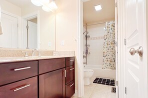 Combined shower/tub, hair dryer, towels, soap