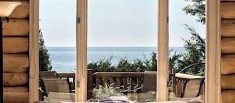Secluded 1200' beachfront private 64 acre log home