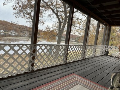 Relax at Grandma’s house with a screened in porch overlooking a private lake!